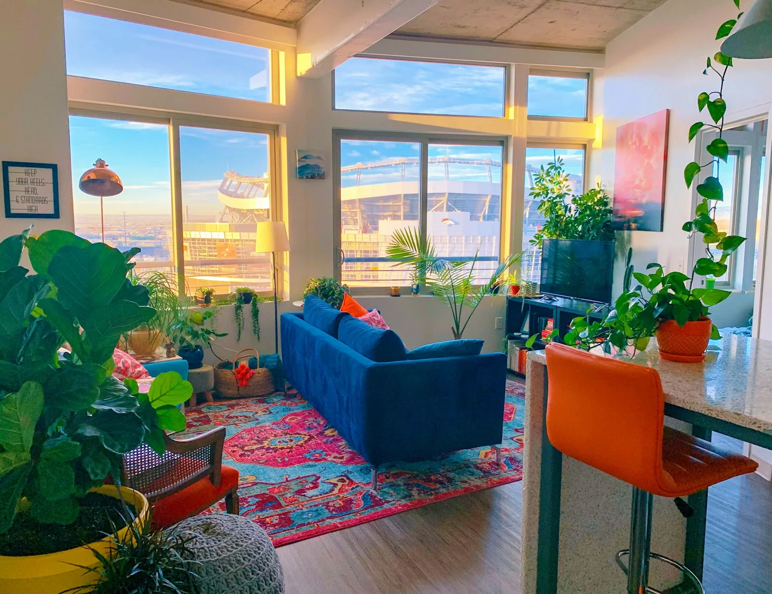 a living room filled with furniture and lots of windows